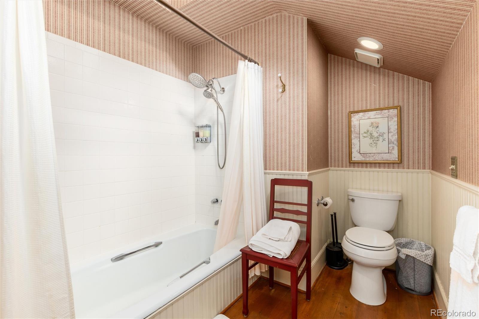 200 Rose Street Georgetown, CO 80444 - Photo 19 of 43 a white toilet sitting next to a bathroom sink
