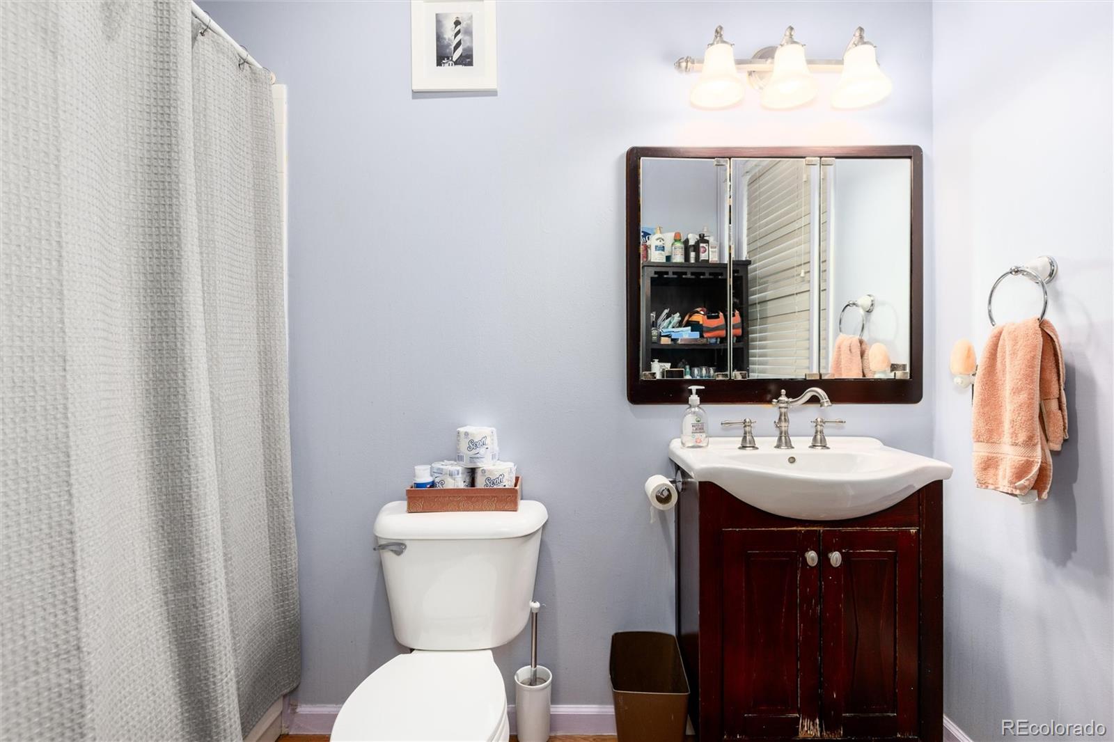 200 Rose Street Georgetown, CO 80444 - Photo 32 of 43 a bathroom with a toilet sink and mirror