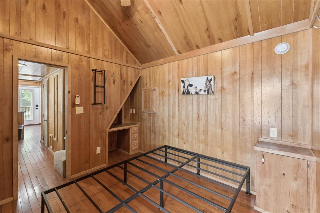 1140 Buckles Road Pierson, FL 32180 - Photo 12 of 39 a view of a hallway with wooden floor and staircase