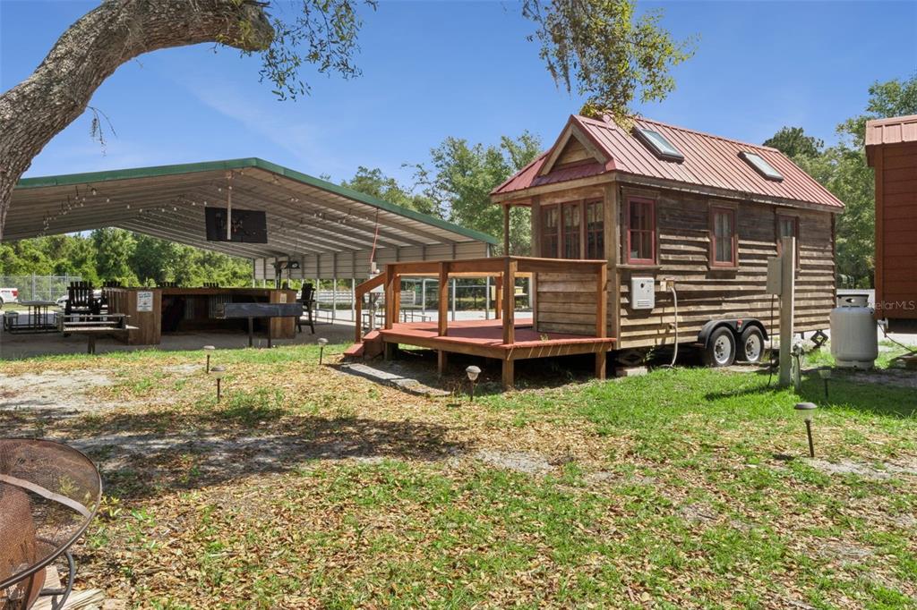 1140 Buckles Road Pierson, FL 32180 - Photo 17 of 39 a front view of a house with garden