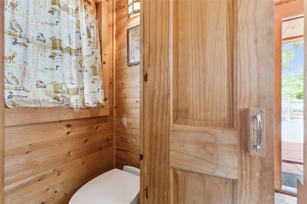 1140 Buckles Road Pierson, FL 32180 - Photo 22 of 39 a bathroom with a toilet and a shower curtain