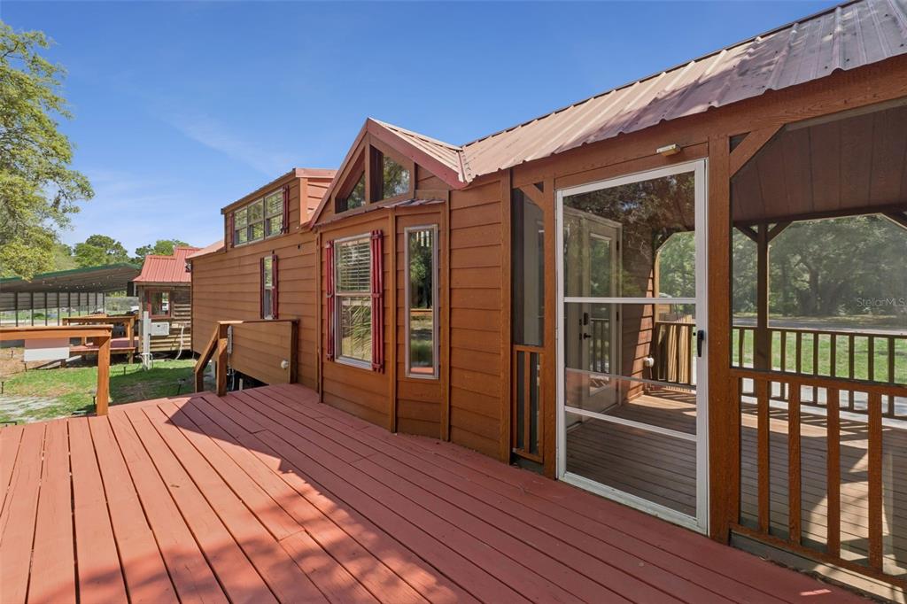 1140 Buckles Road Pierson, FL 32180 - Photo 5 of 39 a view of a house with deck and wooden floor