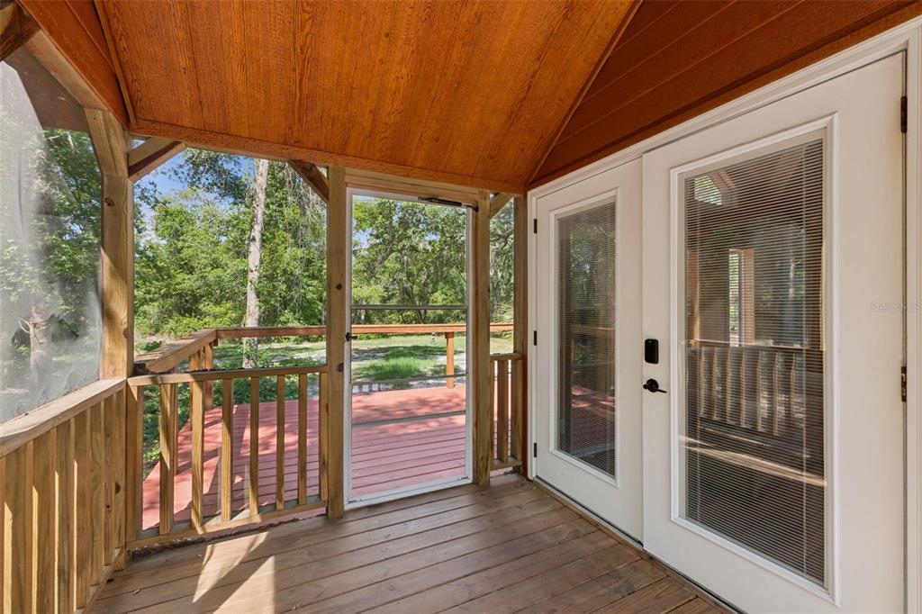 1140 Buckles Road Pierson, FL 32180 - Photo 6 of 39 a view of a porch with wooden floor and outdoor space