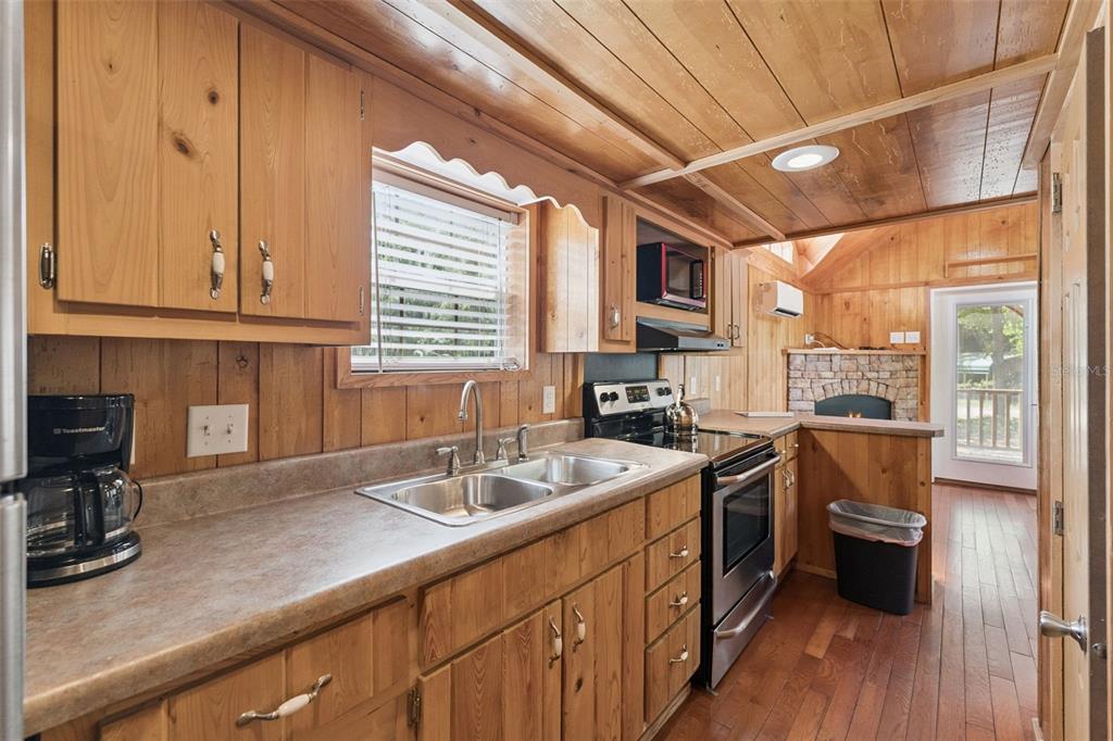 1140 Buckles Road Pierson, FL 32180 - Photo 10 of 39 a kitchen with a sink stove and cabinets