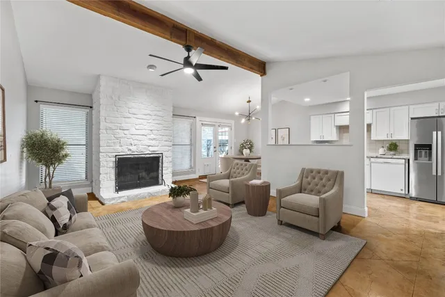 a living room with furniture and a fireplace