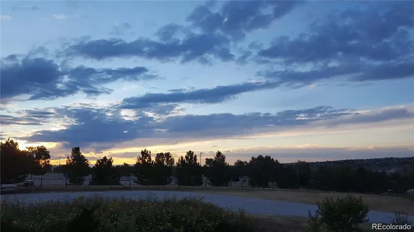 a bedroom with a bed and cabinets