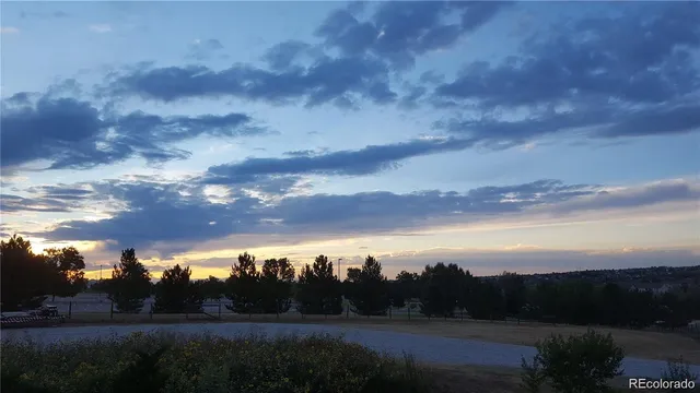 a bedroom with a bed and cabinets