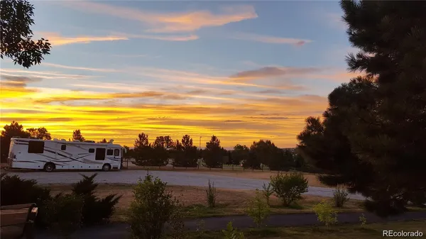 a view of a gate and fence
