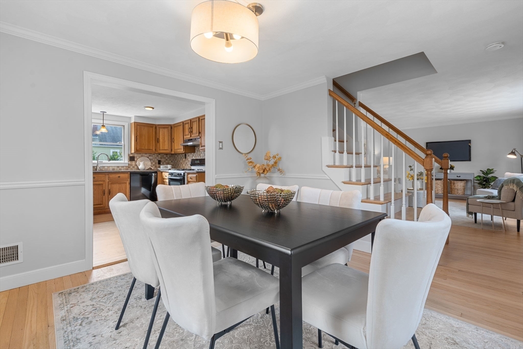 23 Yale Road Arlington, MA 02474 - Photo 11 of 37 a view of a dining room with furniture and a chandelier