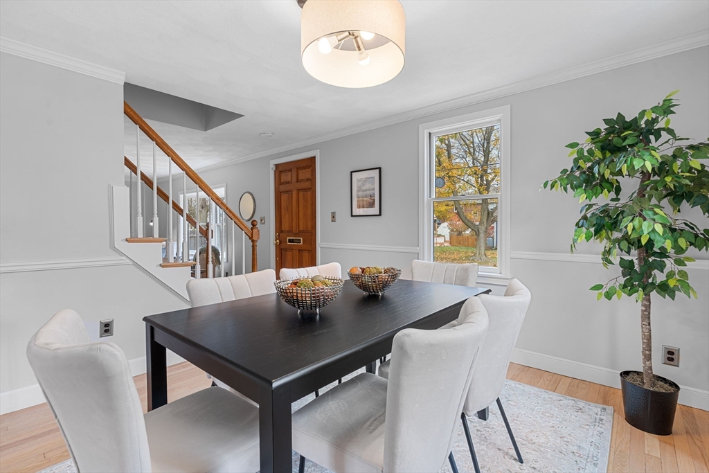 23 Yale Road Arlington, MA 02474 - Photo 12 of 37 a view of a dining room with furniture and a potted plant