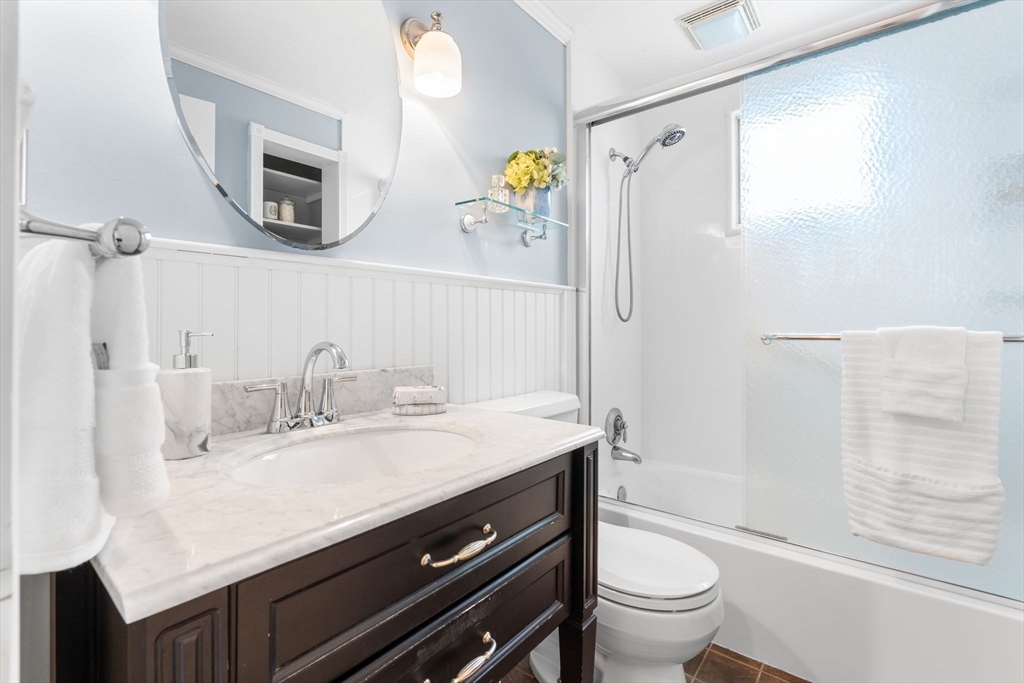 23 Yale Road Arlington, MA 02474 - Photo 16 of 37 a bathroom with a granite countertop sink toilet and shower