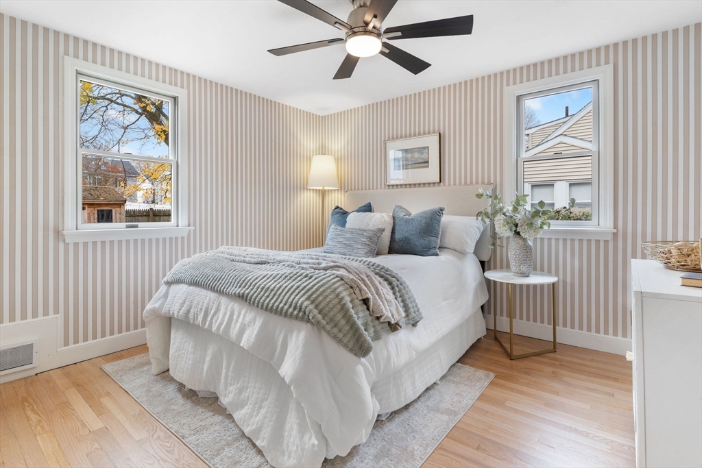 23 Yale Road Arlington, MA 02474 - Photo 18 of 37 a bedroom with a bed and a painting on the wall