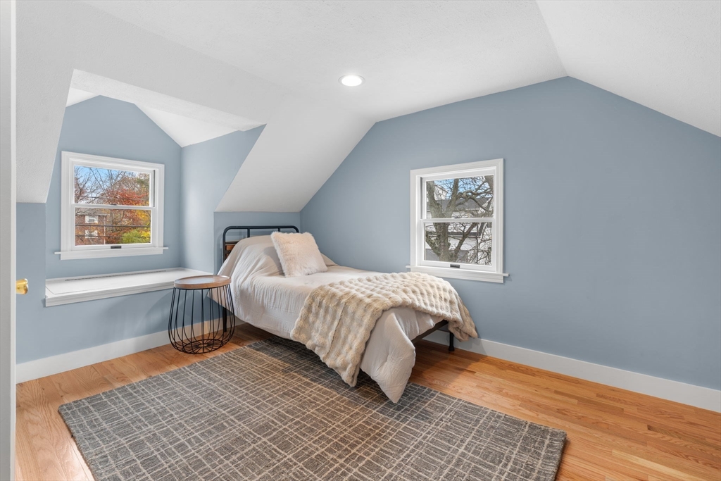 23 Yale Road Arlington, MA 02474 - Photo 21 of 37 a bedroom with a bed rug and wooden floor