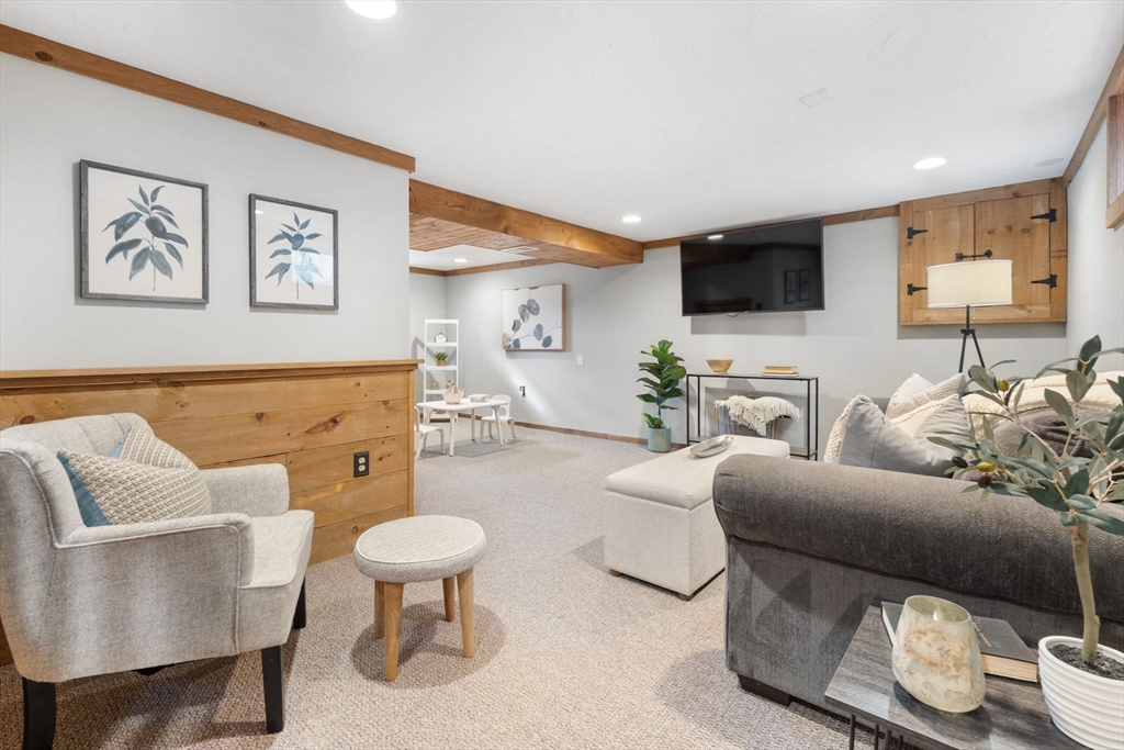 23 Yale Road Arlington, MA 02474 - Photo 29 of 37 a living room with furniture and a view of kitchen
