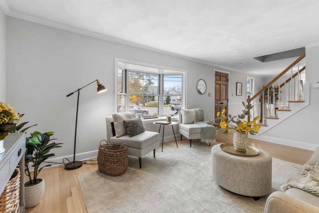 23 Yale Road Arlington, MA 02474 - Photo 9 of 37 a living room with furniture potted plant and a large window