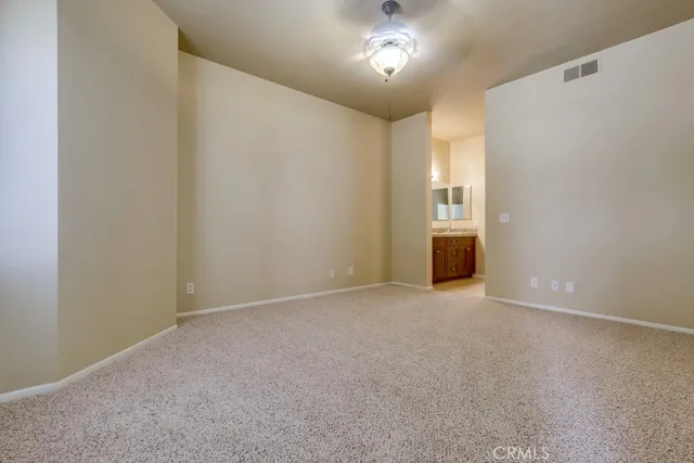 a bathroom with a granite countertop sink mirror and double