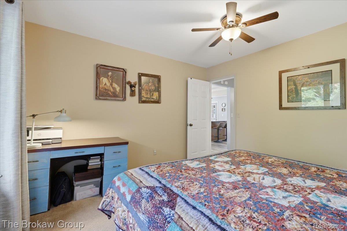 5461 North Henderson Road Davison, MI 48423 - Photo 44 of 64 Carpeted room with a ceiling fan light fixture and neutral wall paint