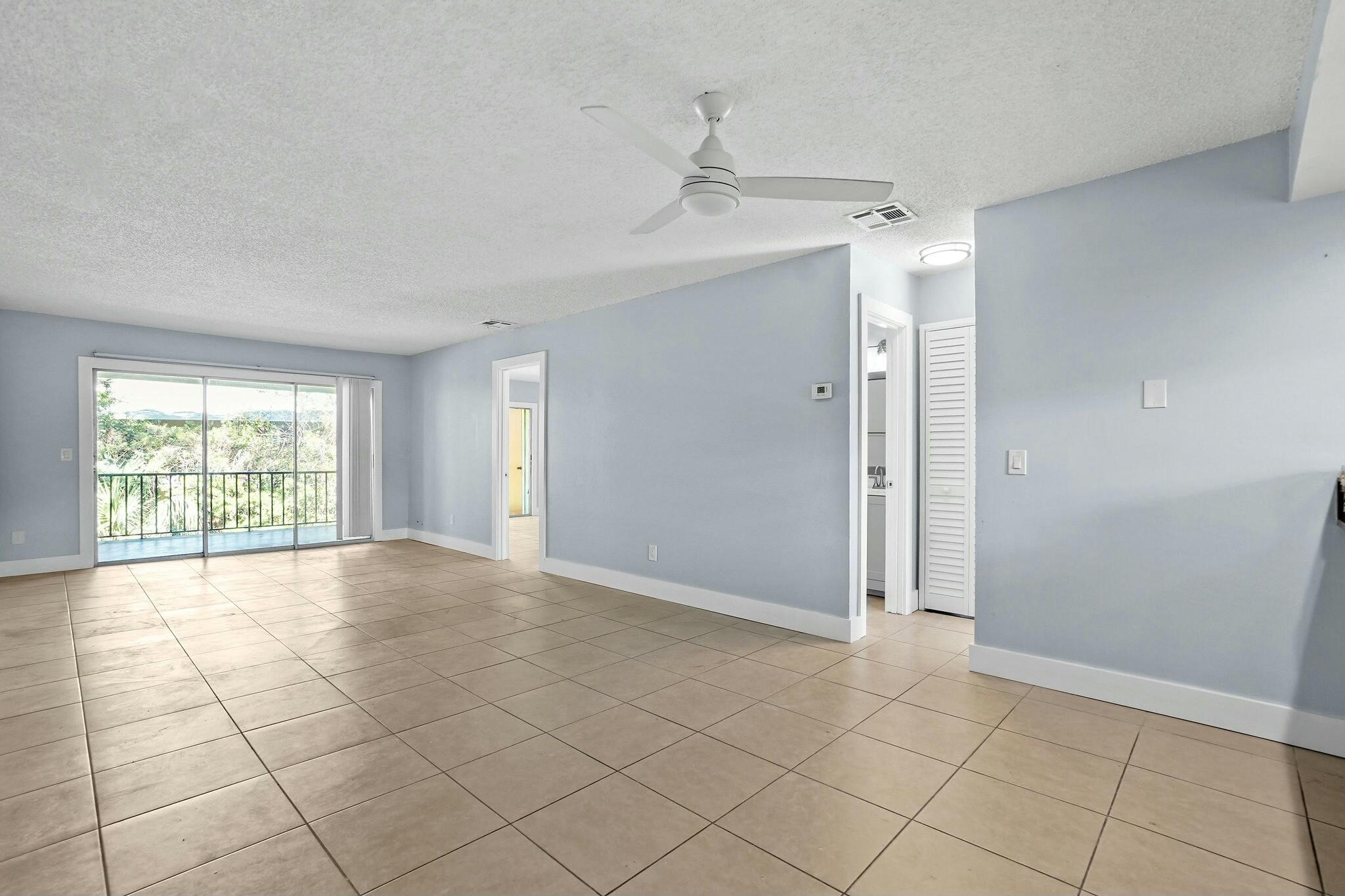 983 Northwest Spruce Ridge Drive, Unit 4 Stuart, FL 34994 - Photo 12 of 56 a view of an empty room with a window