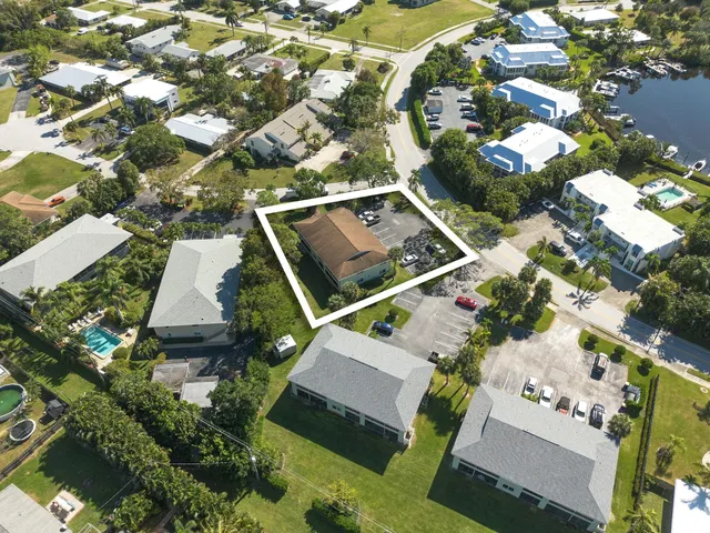 an aerial view of residential houses with outdoor space