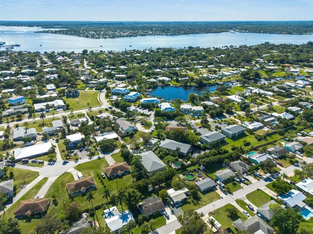 an aerial view of residential houses with outdoor space