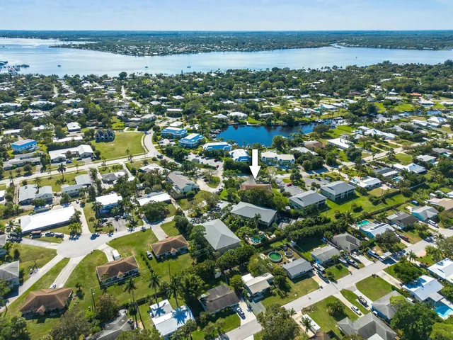 an aerial view of residential houses with outdoor space