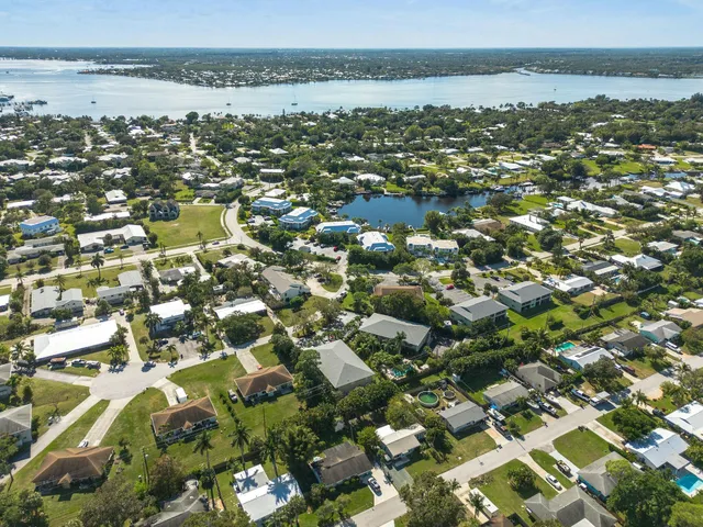 an aerial view of residential houses with outdoor space