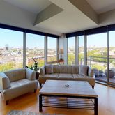 a room with furniture and a large window