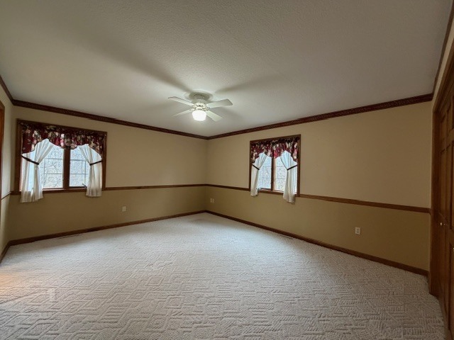5897 Country Meadow Lane Clinton, IL 61727 - Photo 22 of 59 an empty room with windows