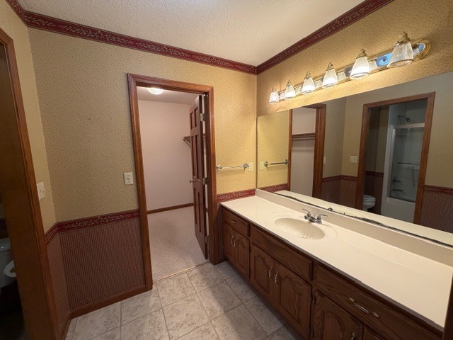 5897 Country Meadow Lane Clinton, IL 61727 - Photo 24 of 59 a bathroom with a double vanity sink and mirror