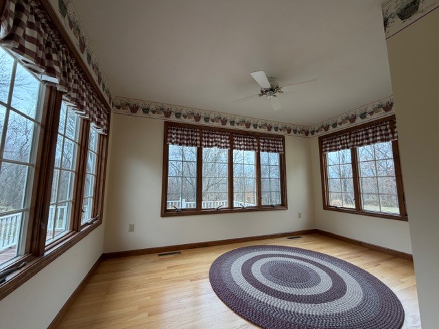 5897 Country Meadow Lane Clinton, IL 61727 - Photo 9 of 59 a view of empty room with window and fireplace