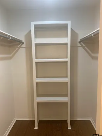 a view of an empty walk in closet
