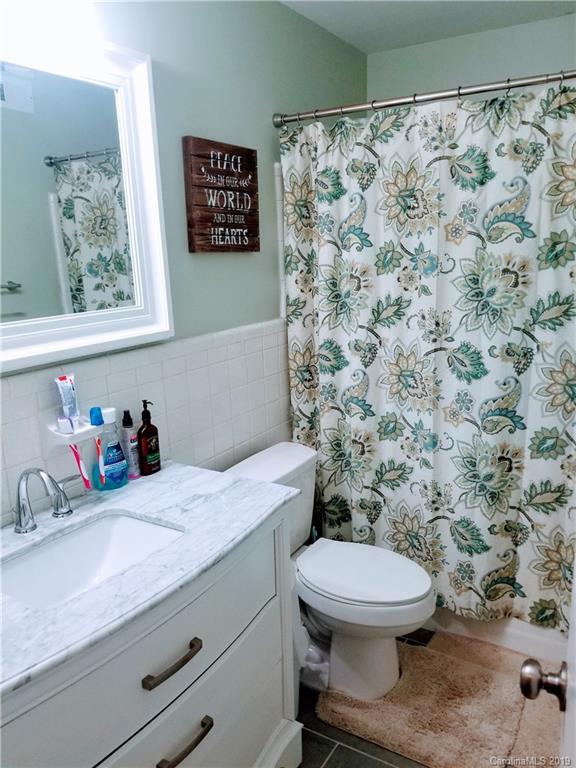 848 McAlway Road Charlotte, NC 28211 - Photo 6 of 9 a bathroom with a granite countertop sink and a toilet