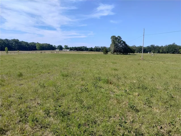 a view of a lake with houses in the back