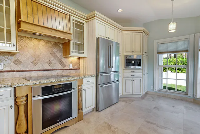 a bathroom with a granite countertop sink a shower and a mirror