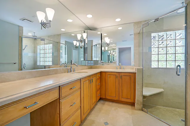 a bathroom with a sink toilet and a mirror