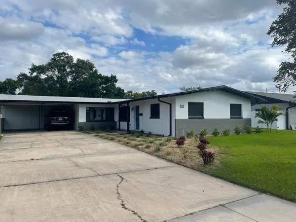 a view of a yard in front of a house
