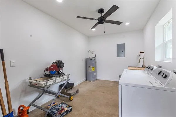 a swimming pool with outdoor seating and yard