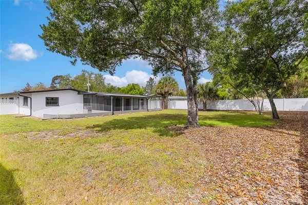 an aerial view of a houses with outdoor space