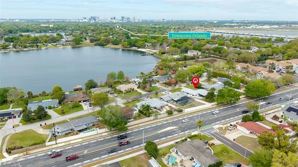 an aerial view of residential houses with outdoor space and swimming pool