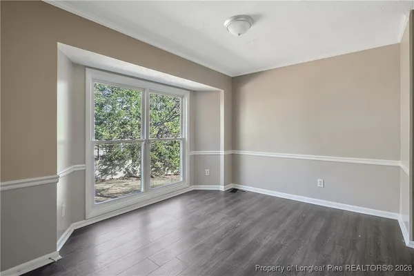 a kitchen with stainless steel appliances a refrigerator stove and cabinets