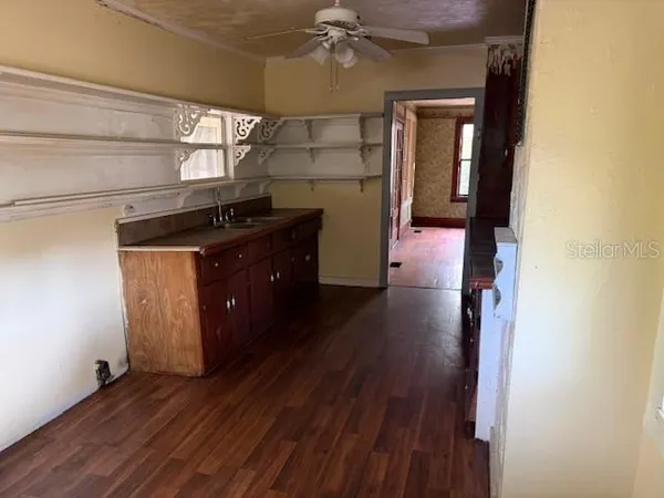 a room with wooden floors and a fireplace
