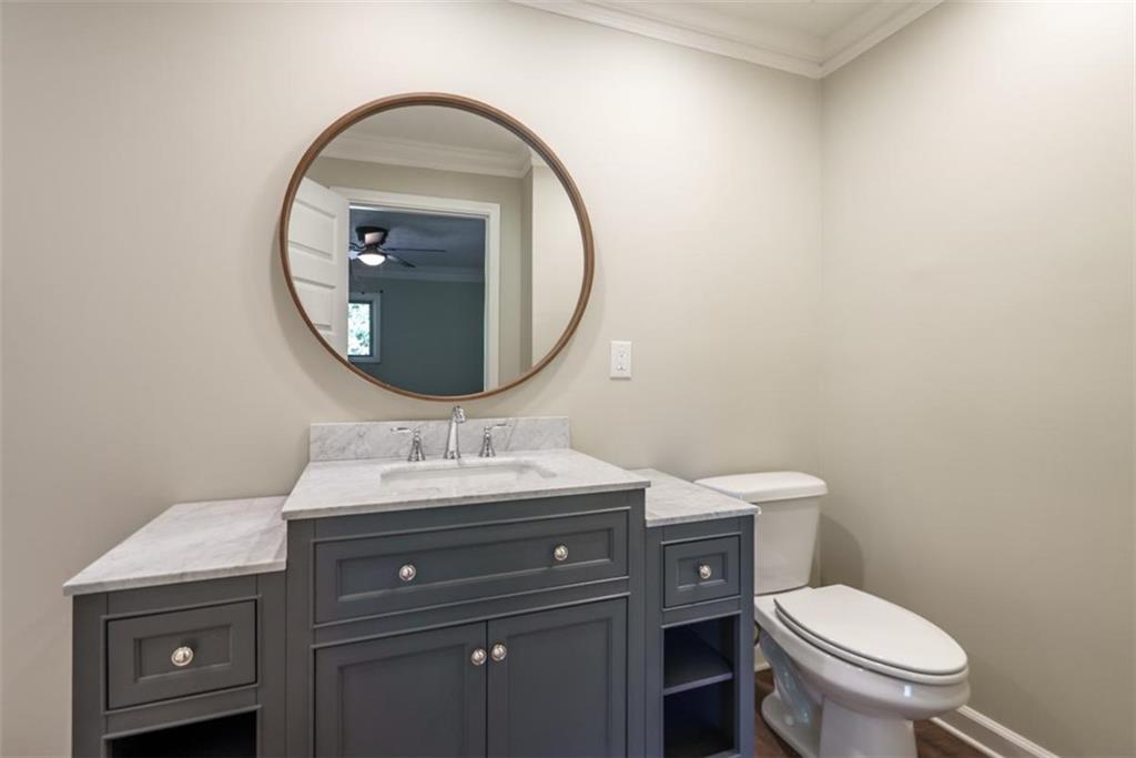 2635 Preston Road Good Hope, GA 30641 - Photo 25 of 68 a bathroom with a toilet a sink and mirror