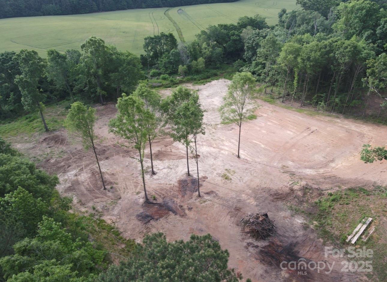 1010 East Sandy Ridge Road, Unit 4 Monroe, NC 28112 - Photo 6 of 15 a backyard of a house with lots of green space