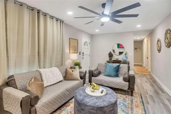 a living room with furniture and a rug