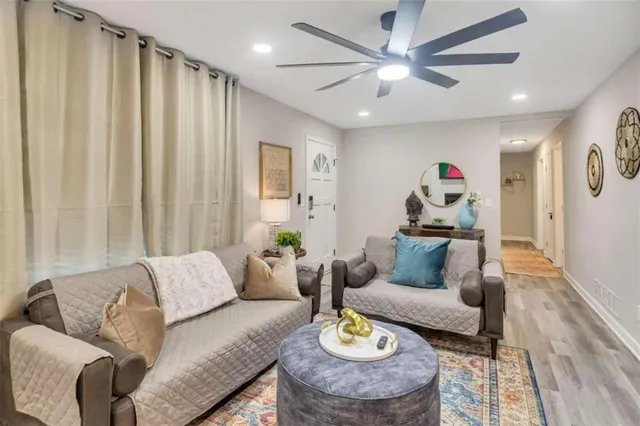 a living room with furniture and a rug