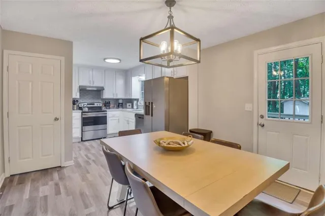 a kitchen with kitchen island a refrigerator stove and microwave