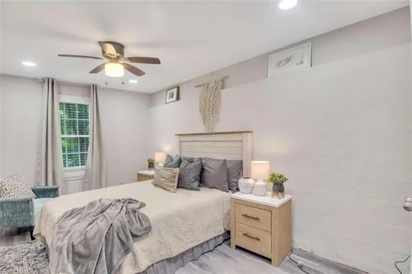 a bedroom with a bed and window