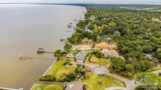an aerial view of residential house with swimming pool