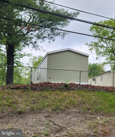 a house with a tree in front of it