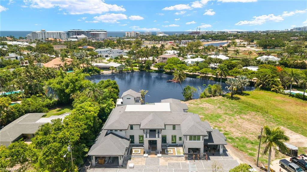 616 Bougainvillea Road Naples, FL 34102 - Photo 16 of 21 View of subject property with a large body of water